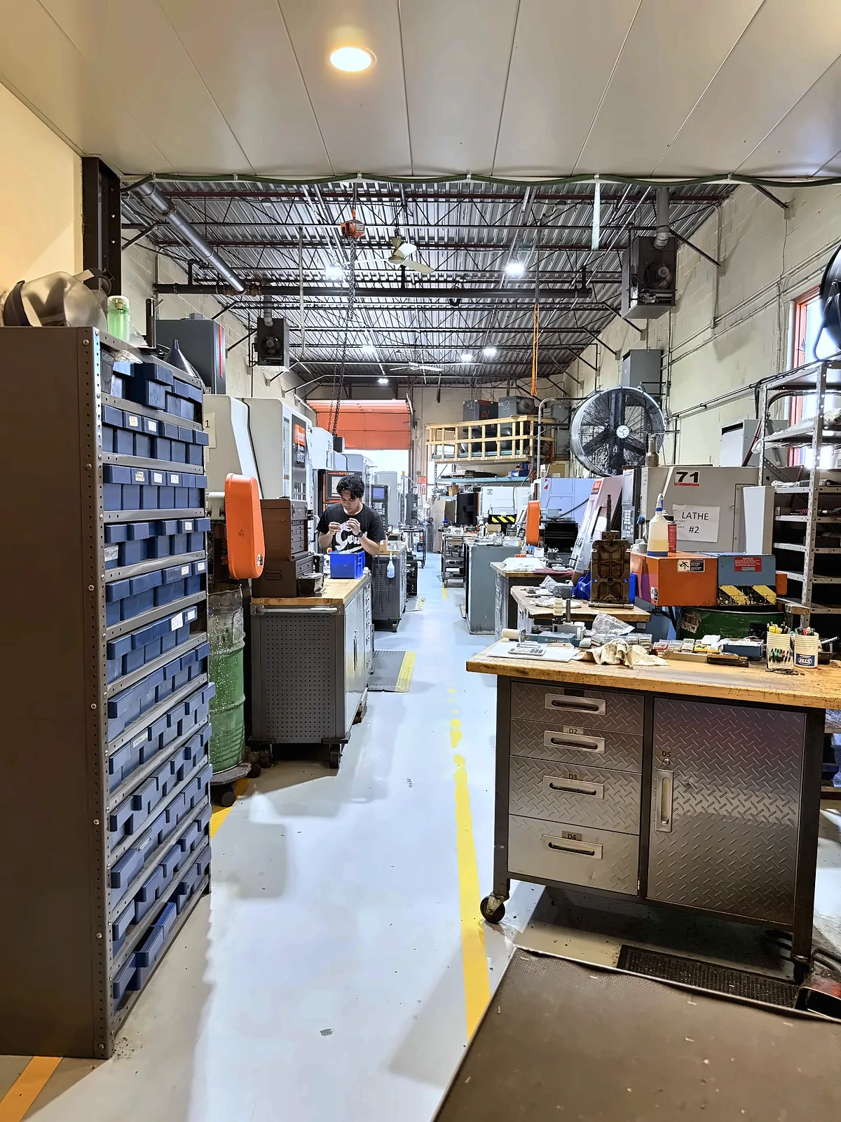Shop aisle with tooling cabinets and workbench
